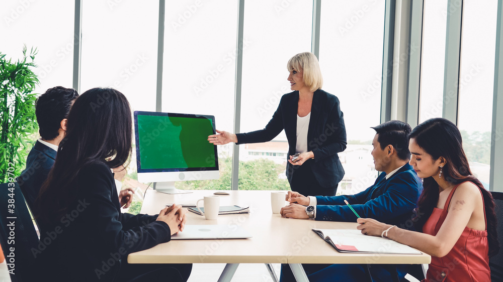 Business people in the conference room with green screen chroma key TV or computer on the office tab