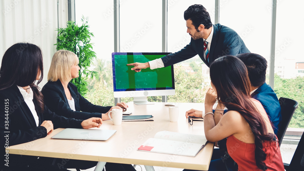 Business people in the conference room with green screen chroma key TV or computer on the office tab