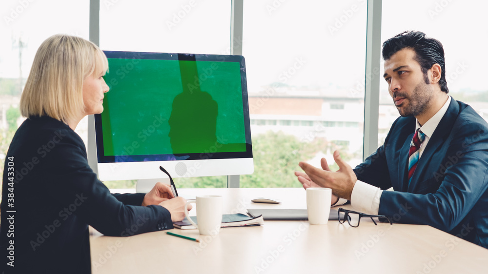 Business people in the conference room with green screen chroma key TV or computer on the office tab