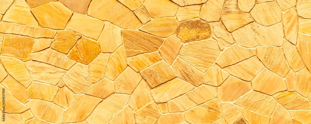 Panorama of Brown stone cladding wall pattern and texture background