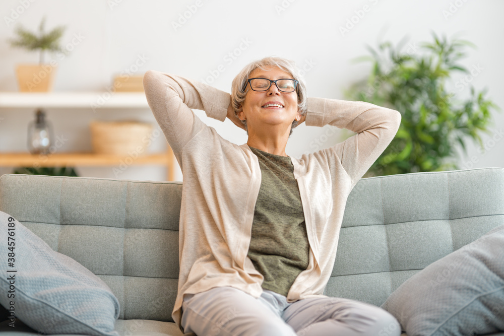 Senior woman sitting on the sofa