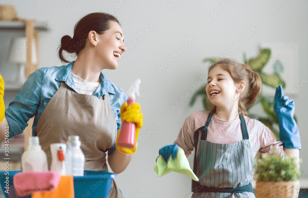 family cleaning the room