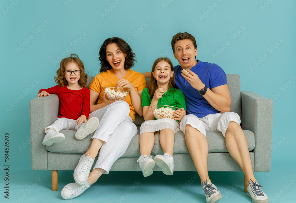 Happy loving family on bright color background.