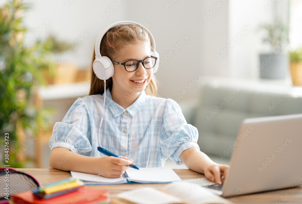 Girl doing homework or online education.