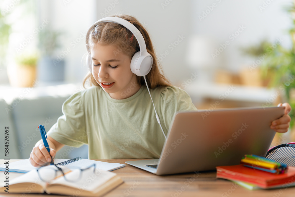 Girl doing homework or online education.