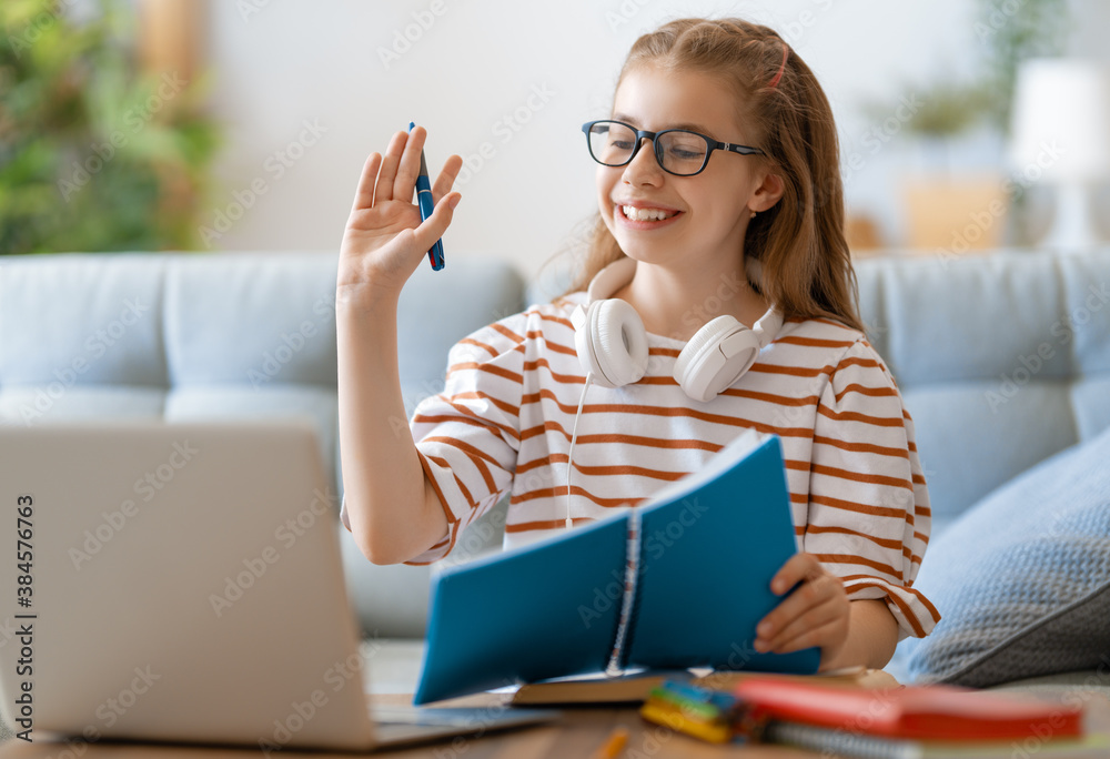 Girl doing homework or online education.