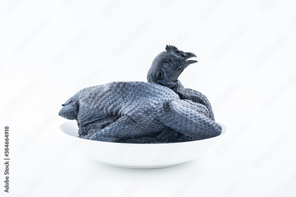 A fresh black chicken on white background