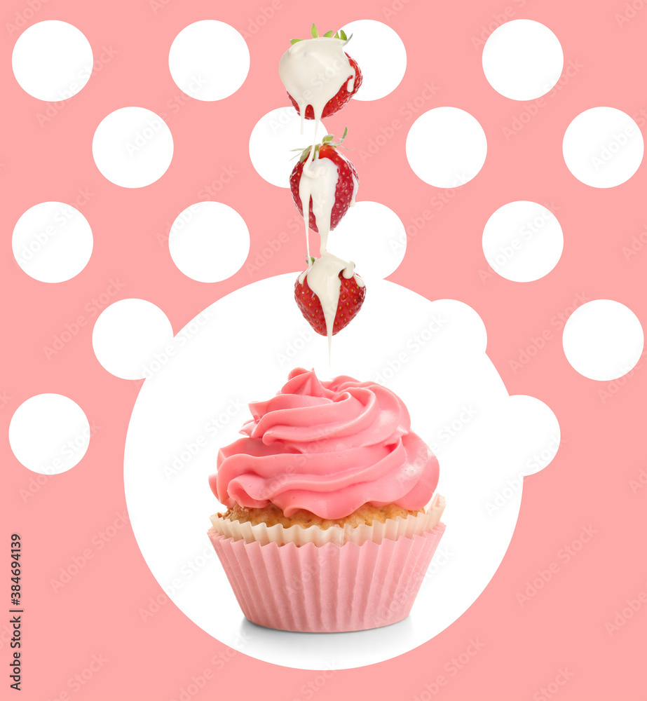 Tasty cupcake and falling strawberry with white chocolate on color background