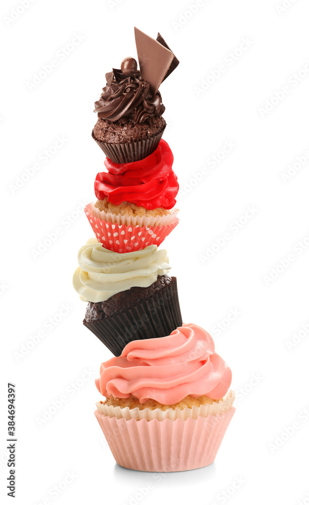 Stack of tasty cupcakes on white background