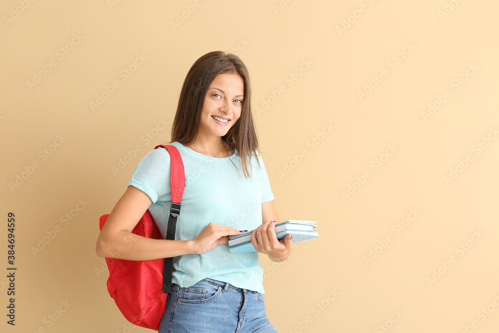 Portrait of female student on color background