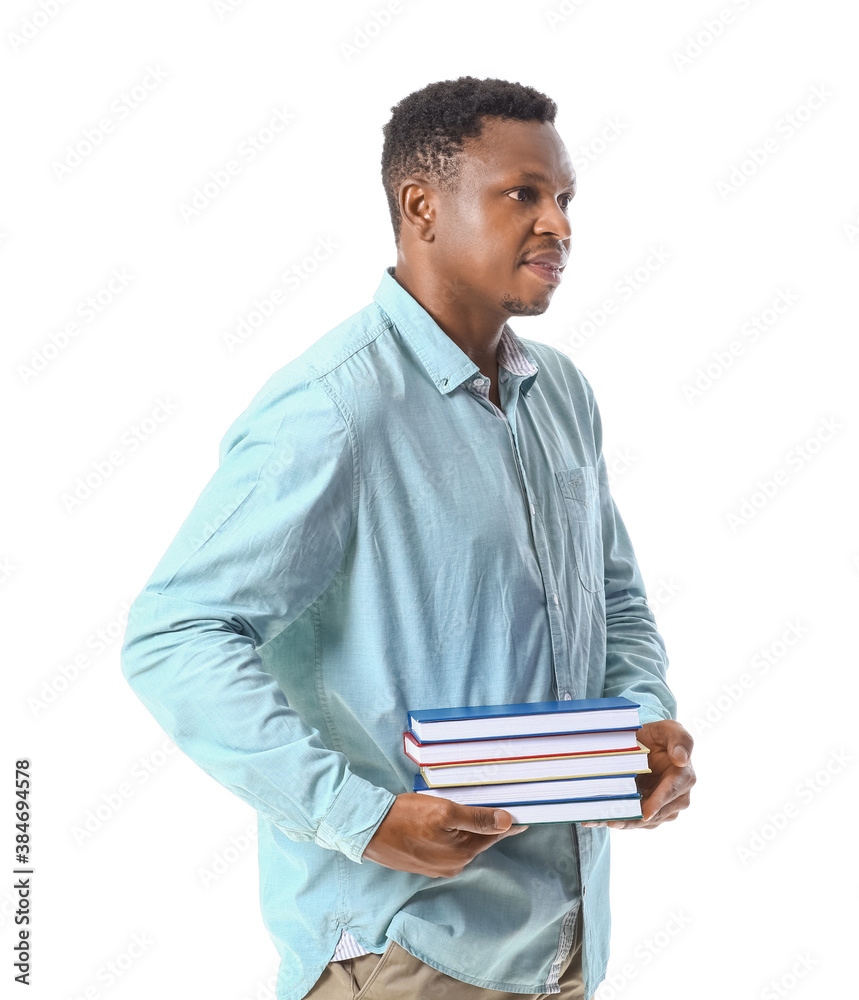 African-American man with books on white background