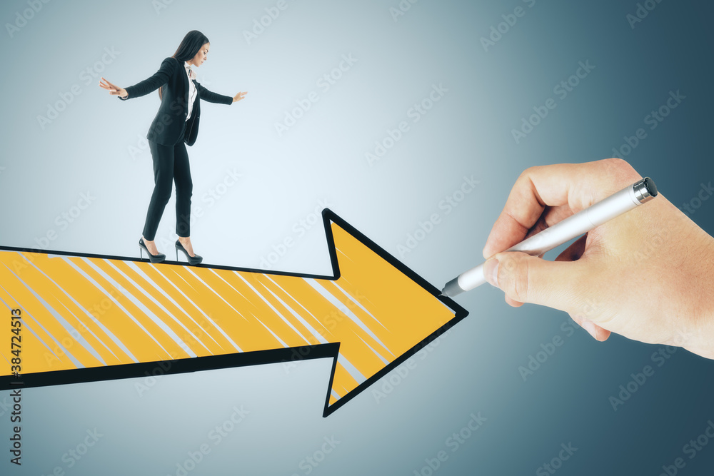 Hand drawing yellow arrow with walking businesswoman