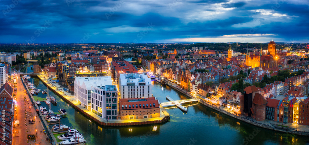 Aerial view of the Gdansk city over Motlawa river with amazing architecture at dusk, Poland