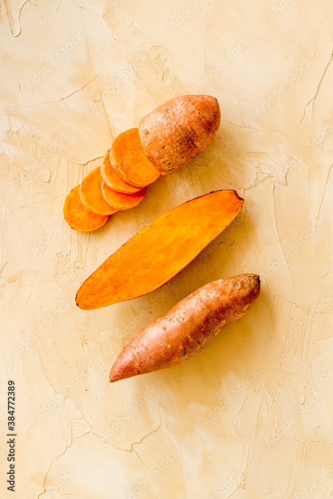 Pattern with sweet potato - yams. Organic vegetables background, overhead view