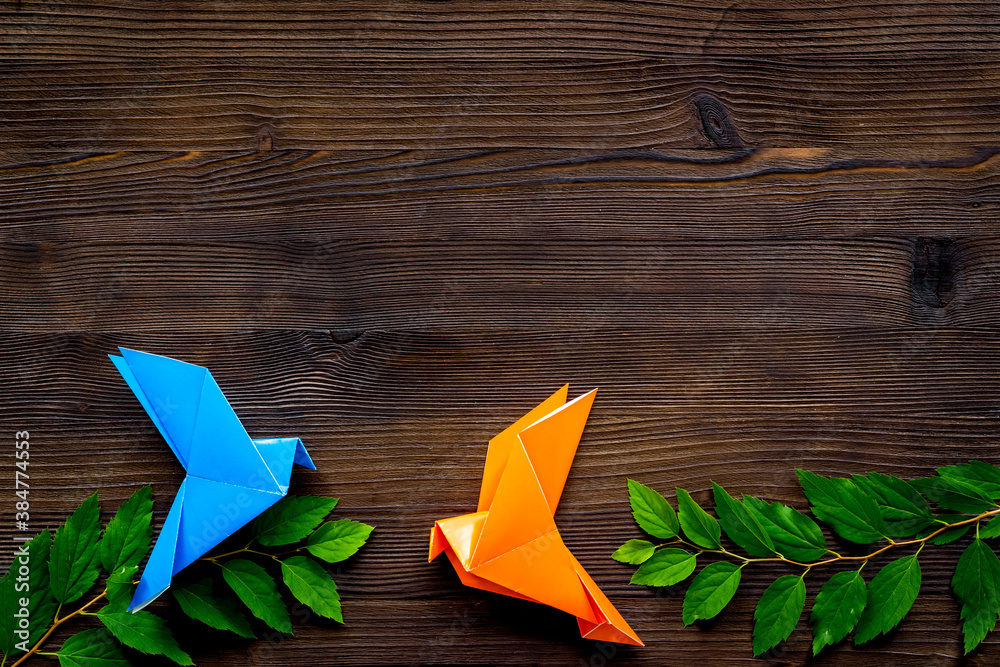 Origami birds are flying, overhead top view