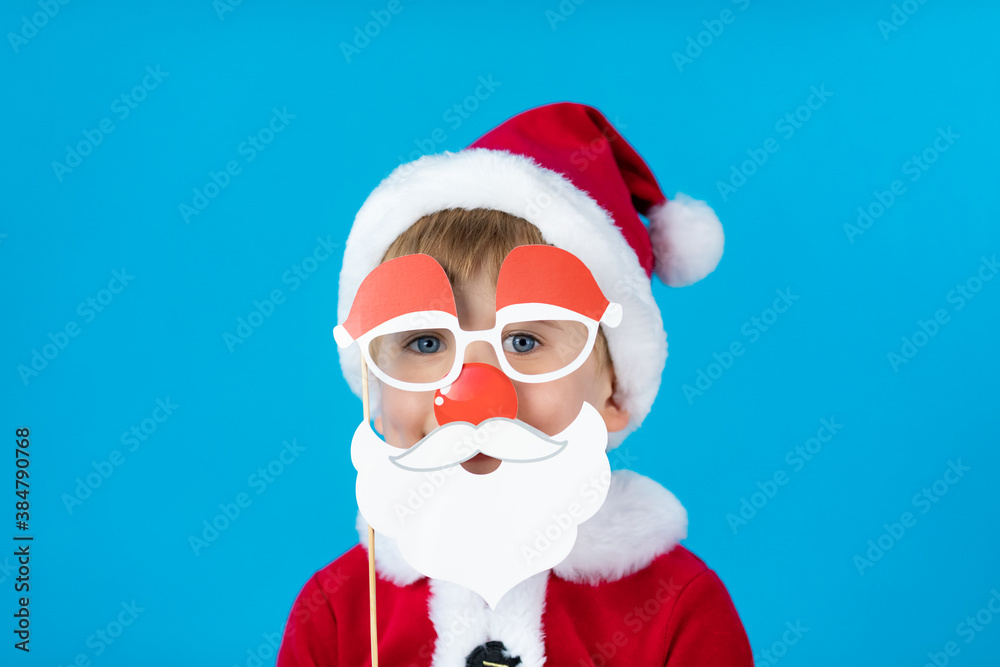 Happy child with Christmas paper props