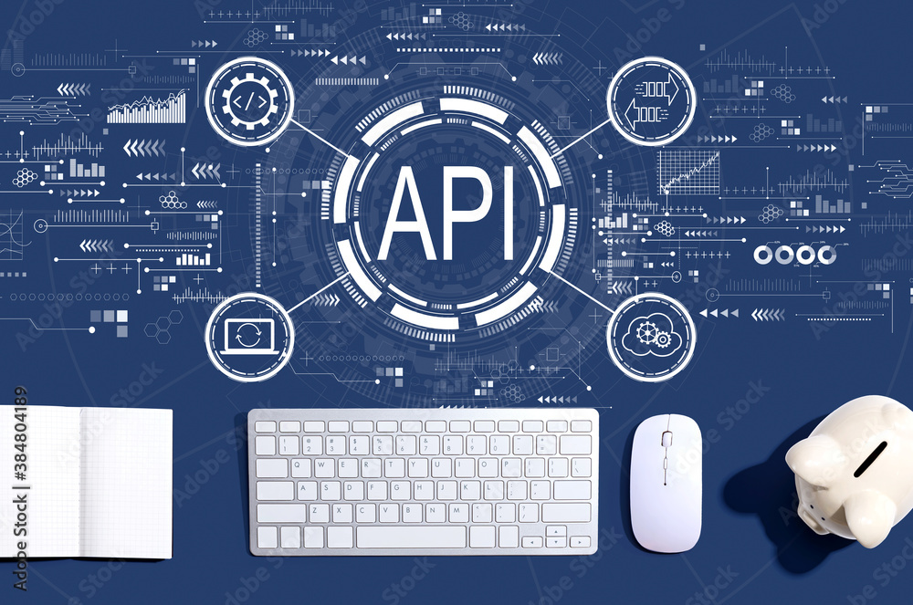 API - application programming interface concept with a computer keyboard and a piggy bank