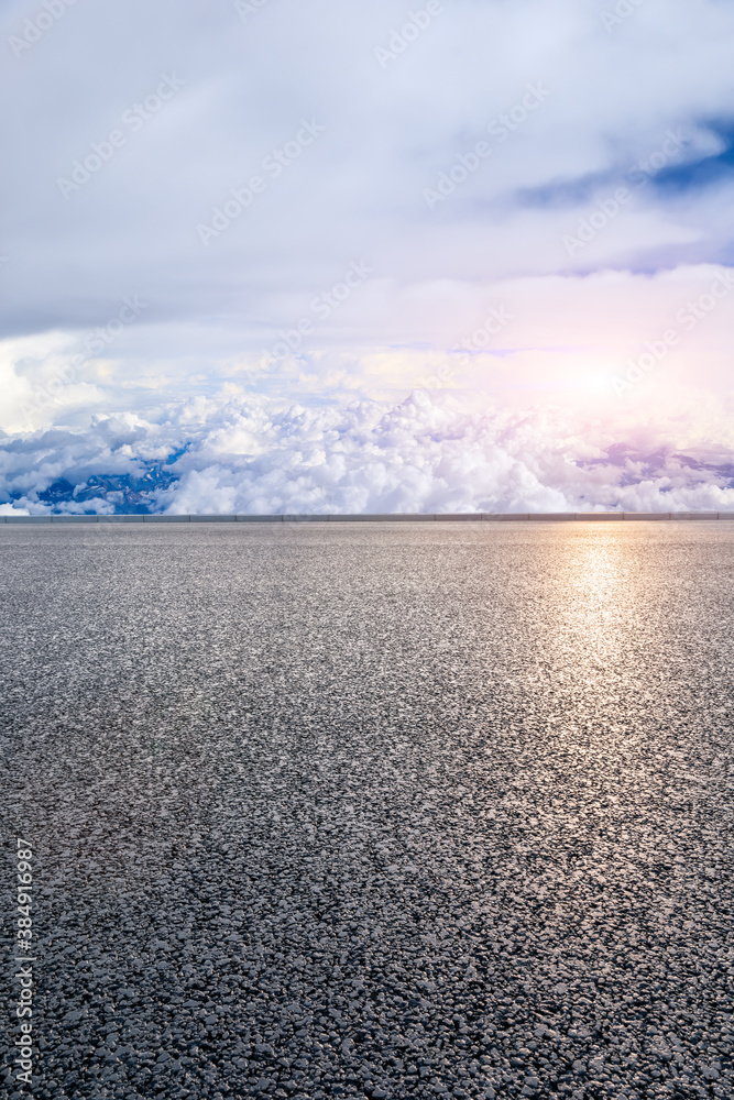 Empty asphalt road and blue sky with white clouds scenery.