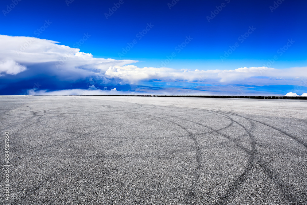 Empty race track and sky clouds landscape.