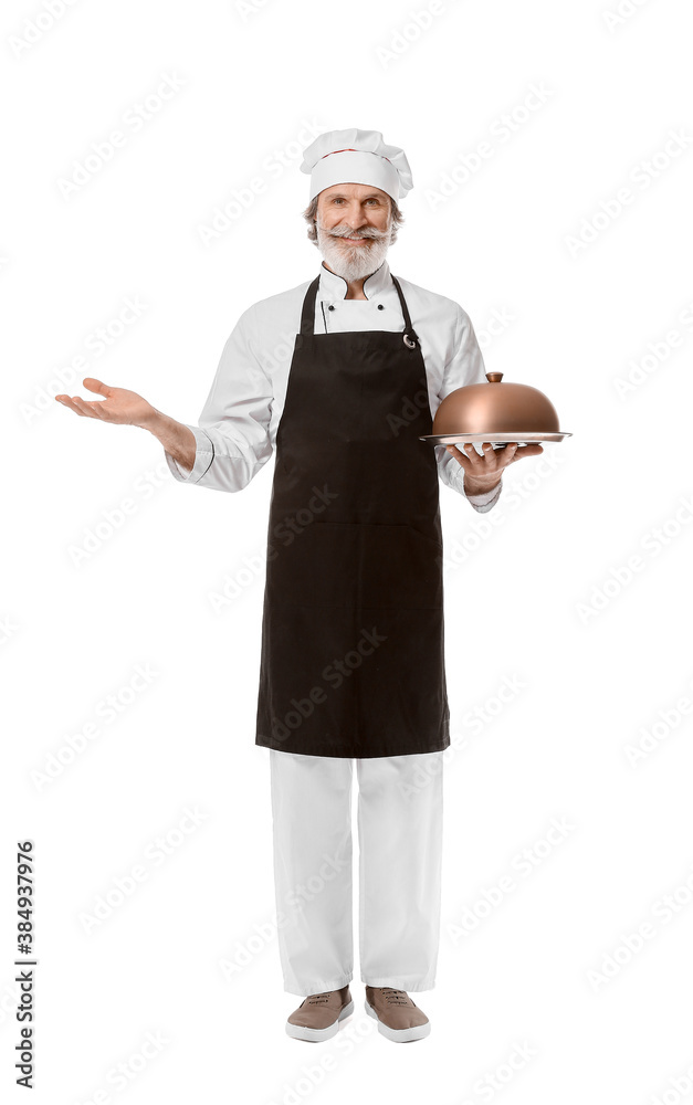 Mature male chef with tray and cloche on white background