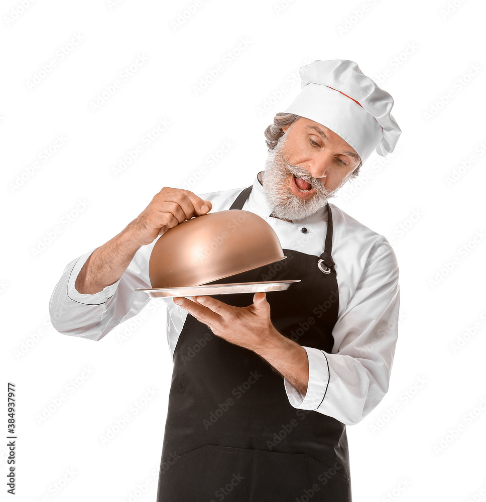 Mature male chef with tray and cloche on white background