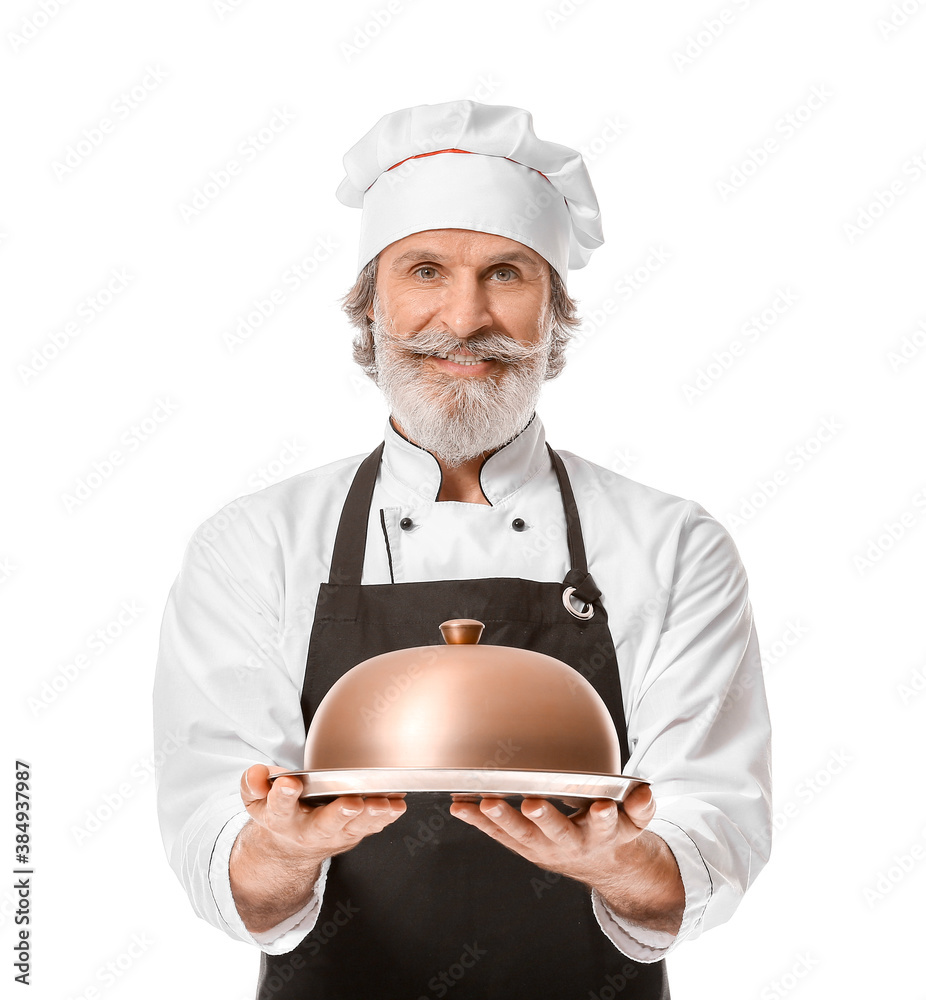 Mature male chef with tray and cloche on white background