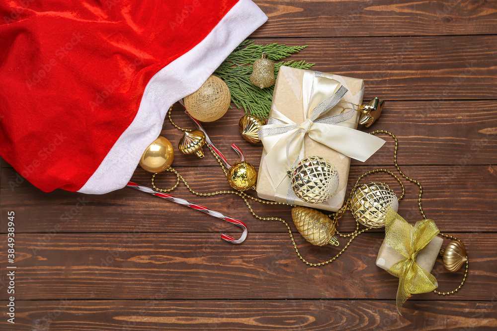 Santa bag with gifts on wooden background