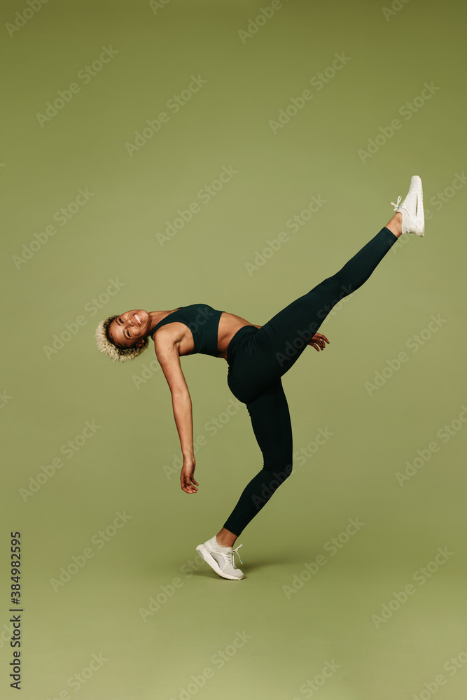 Athletic woman doing fitness exercises