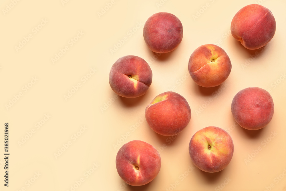 Sweet peaches on color background