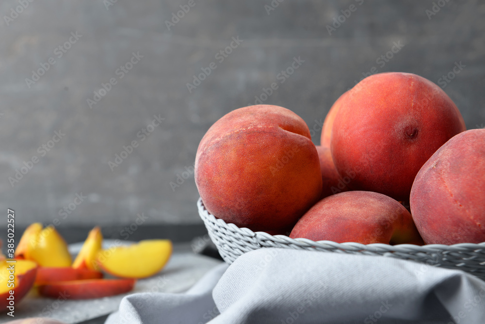 Sweet peaches in bowl on table