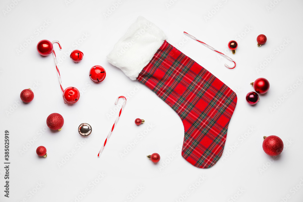 Composition with Christmas sock on white background