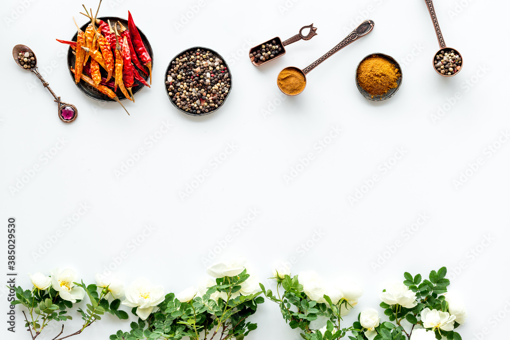 Set of hot Indian spices with flowers, top view