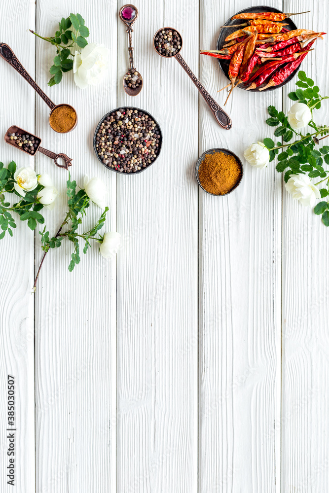 Set of hot Indian spices with flowers, top view