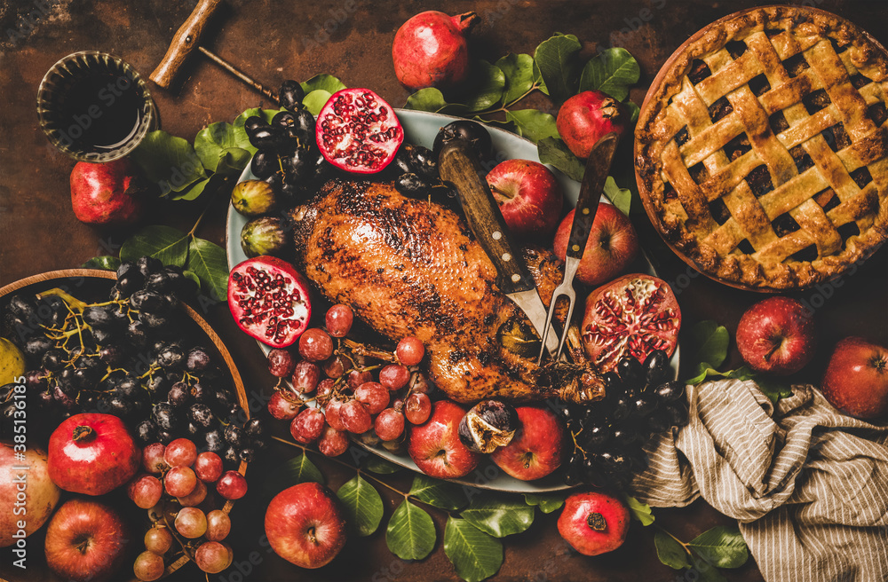 Autumn Thanksgiving, Friendsgiving, family gathering dinner. Flat-lay of Fall table with roasted duc