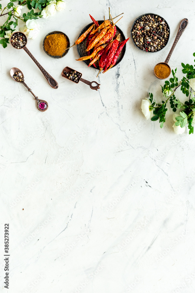 Various aromatic and hot spices with herba and flowers, view from above