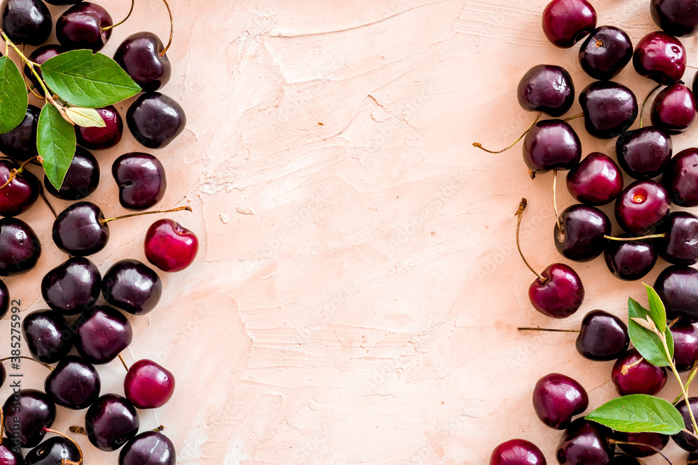 Frame of red cherries, berries background. Overhead view