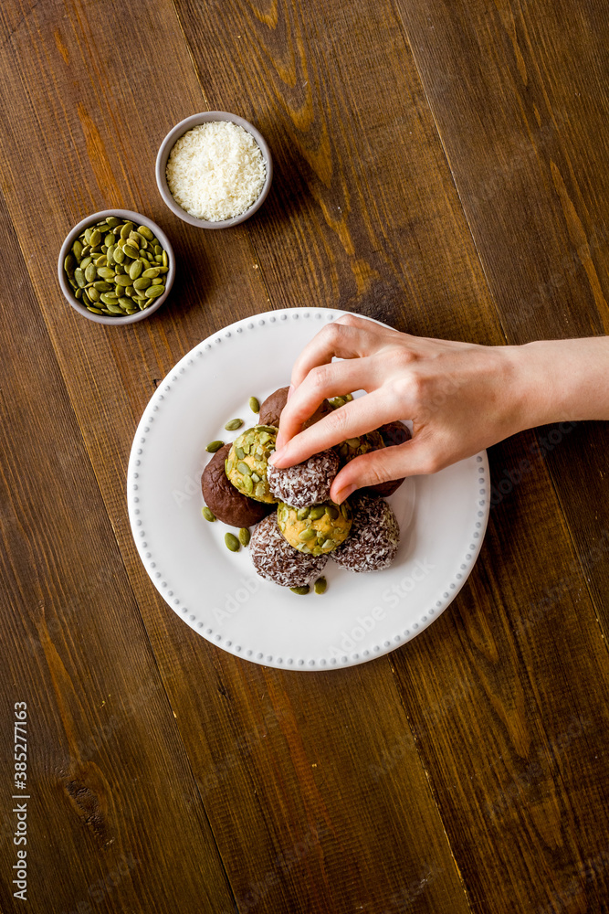 Homemade raw chocolate balls - vegan truffles with cacao and coconut