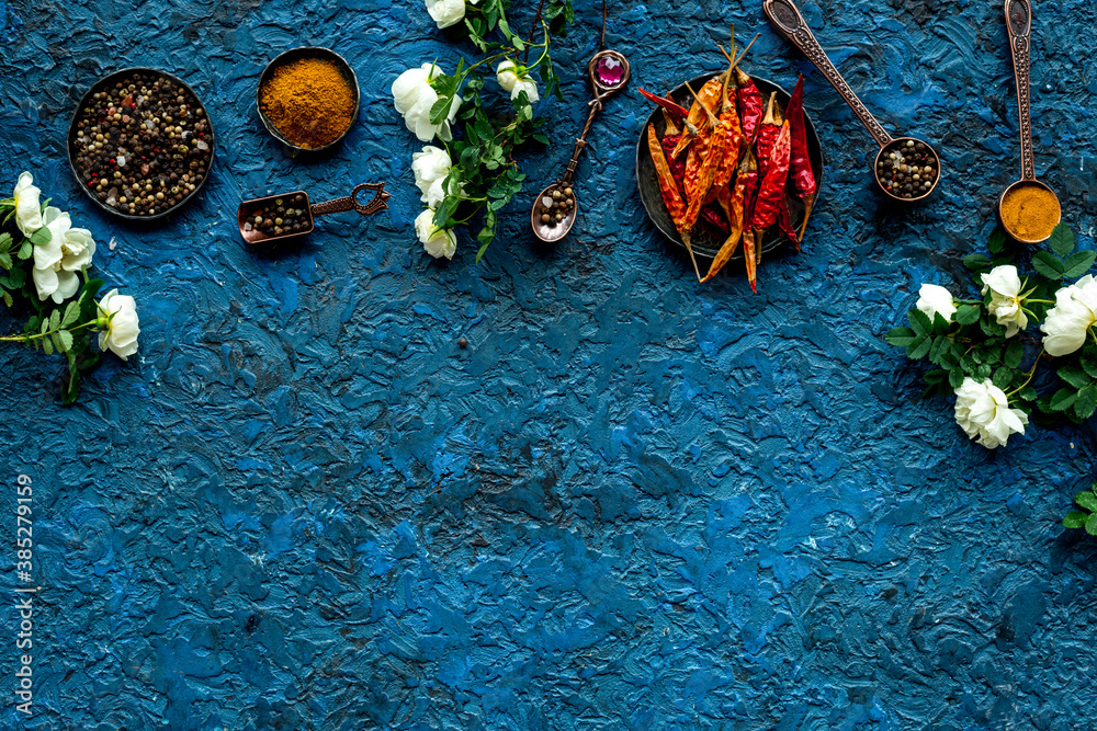 Various aromatic and hot spices with herba and flowers, view from above