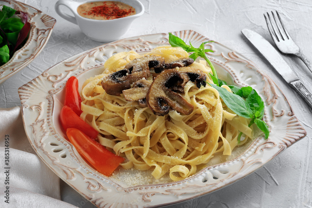 Pasta Fettuccine Bolognese with mushrooms and vegetables on white plate. Menu concept.