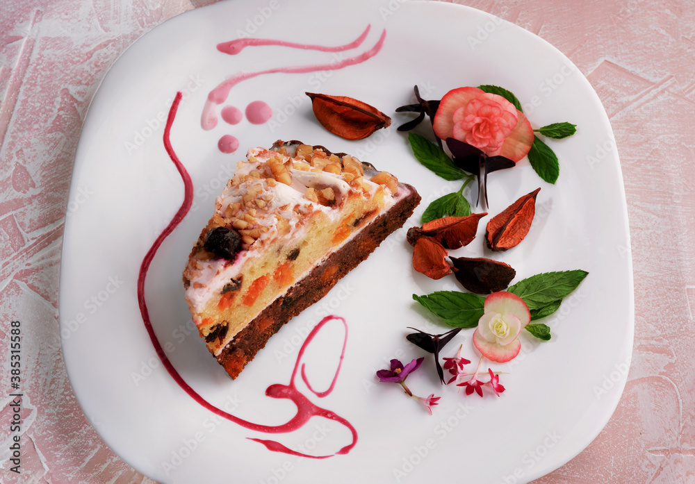 Slice of cheesecake with dried fruits decorated on white plate.