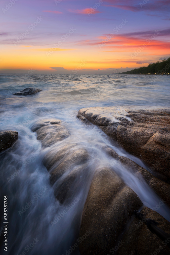 Seascape at sunset taken with long exposure to created slow movement of wave