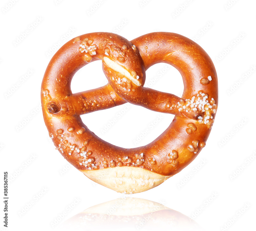 Freshly baked pretzel close-up, isolated on a white background