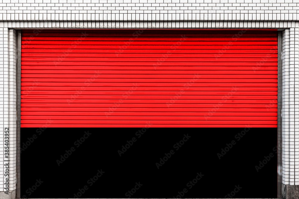 Automatic red roller shutter doors on the ground floor of the house