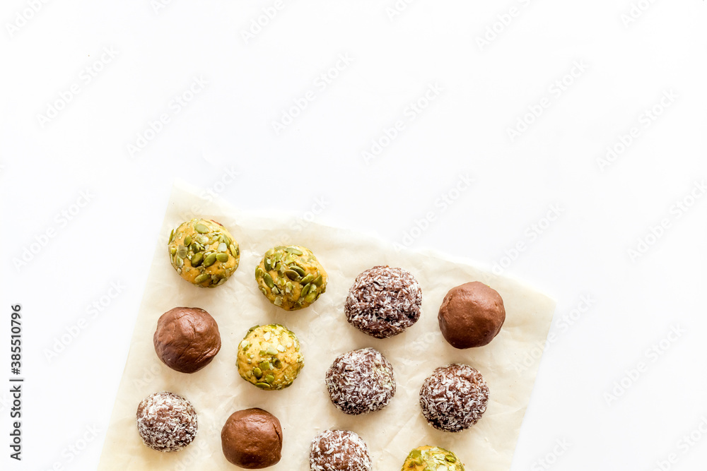 Top view of raw vegan energy balls with nuts and cacao