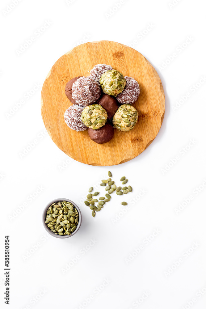 Homemade raw chocolate balls - vegan truffles with cacao and coconut