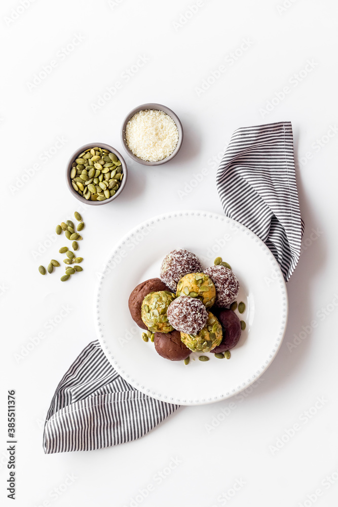 Granola raw energy balls on a plate, top view