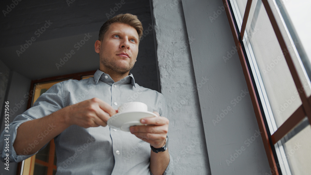 Young businessman with a cup of coffee