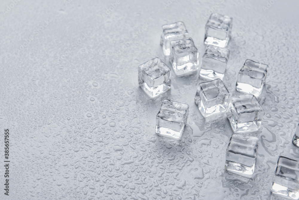 Ice cubes on grey background