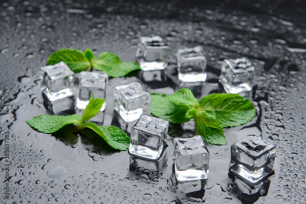 Ice cubes and mint on dark background