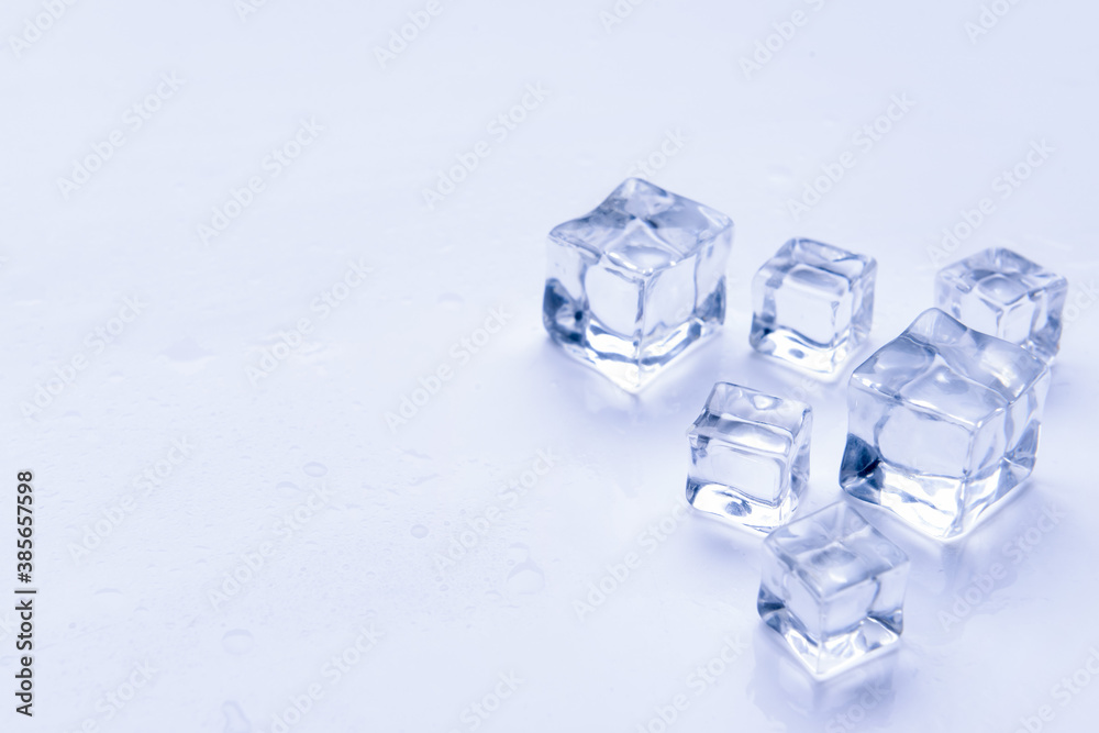 Ice cubes on light background